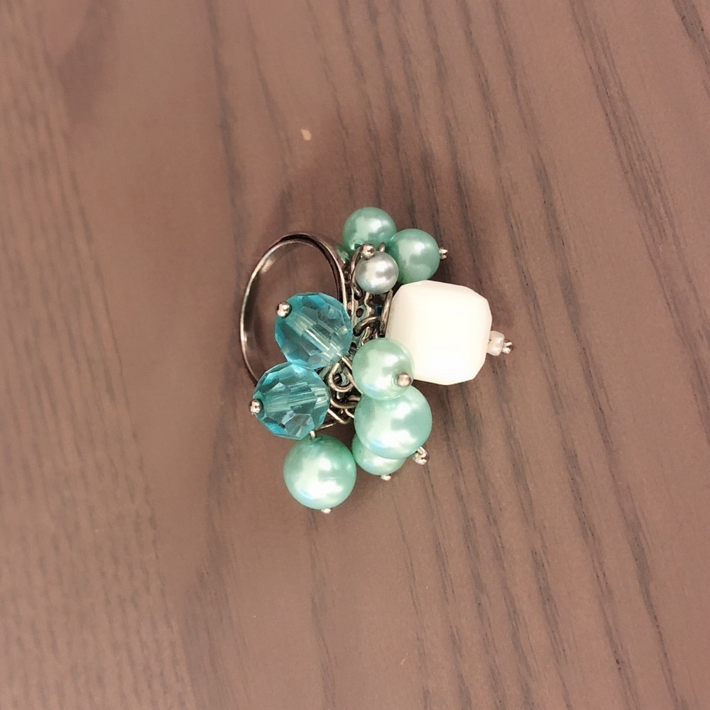 Silver ring with blue charms